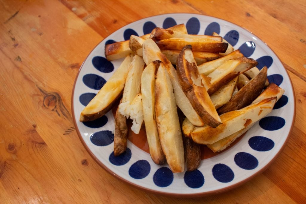 Hand cut french fries from an air fryer.