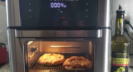 The Instant Vortex Oven with a couple small pizzas inside